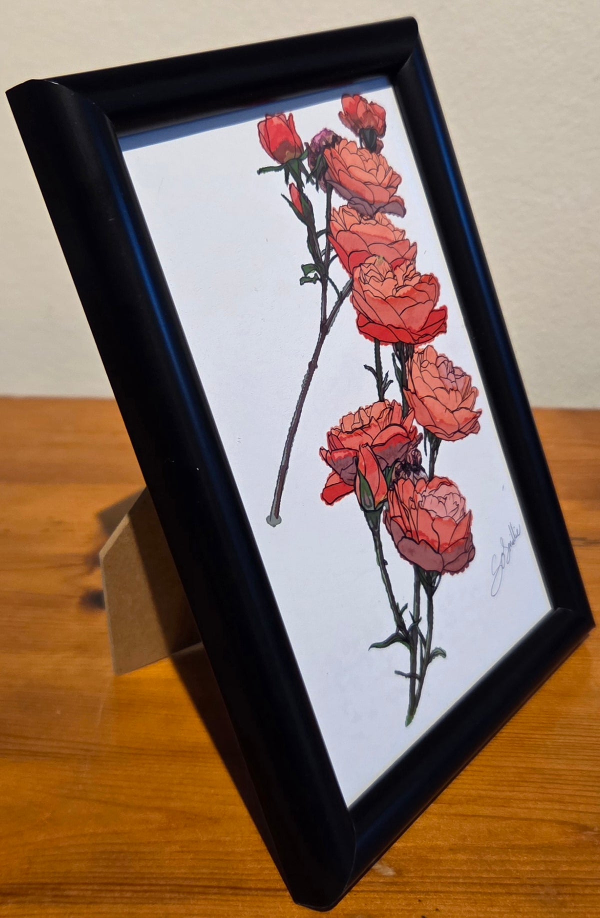 Orange Roses Tower A6 Print is Black Frame